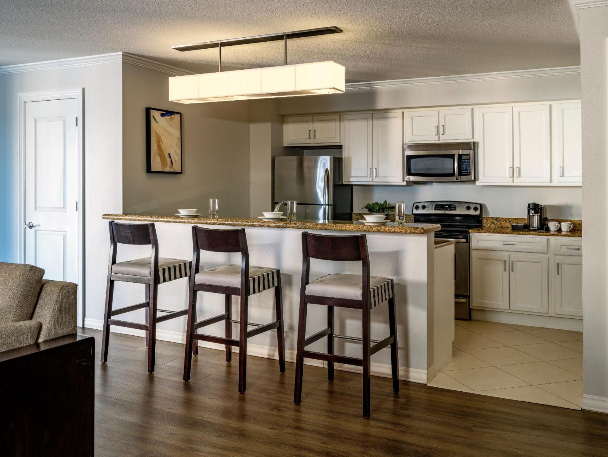 Two-Bedroom Residential Suite with Full Kitchen and Pool View