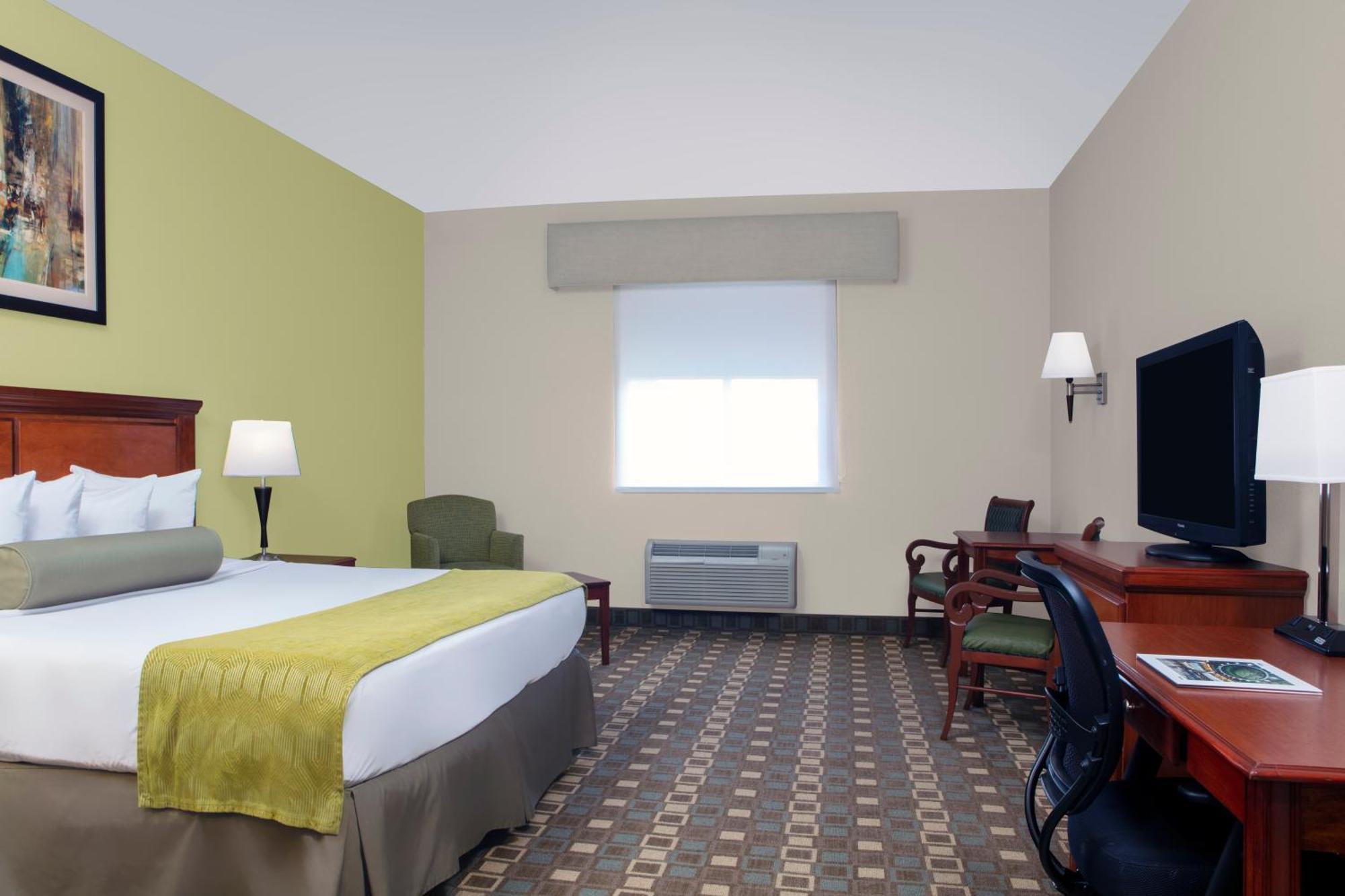 Habitación con ducha a ras de suelo, adaptada para personas de movilidad reducida - Cama extragrande